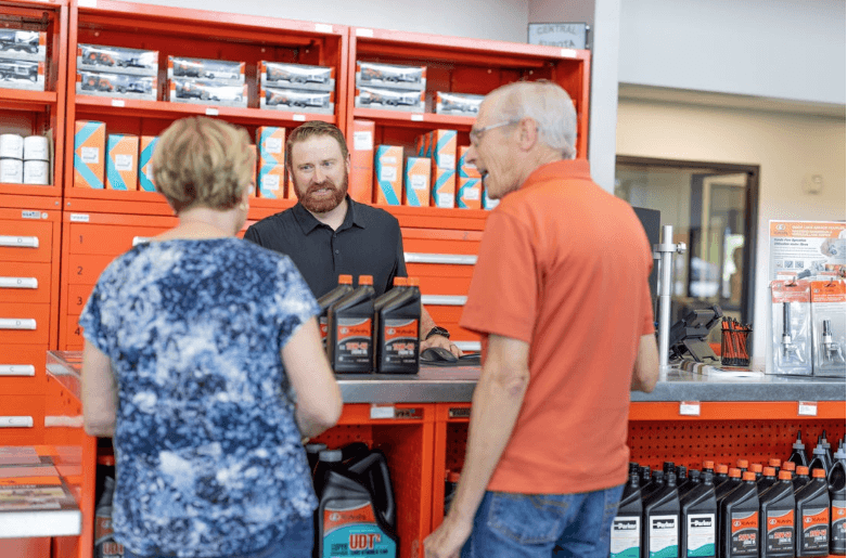 A Kubota employee helping customers