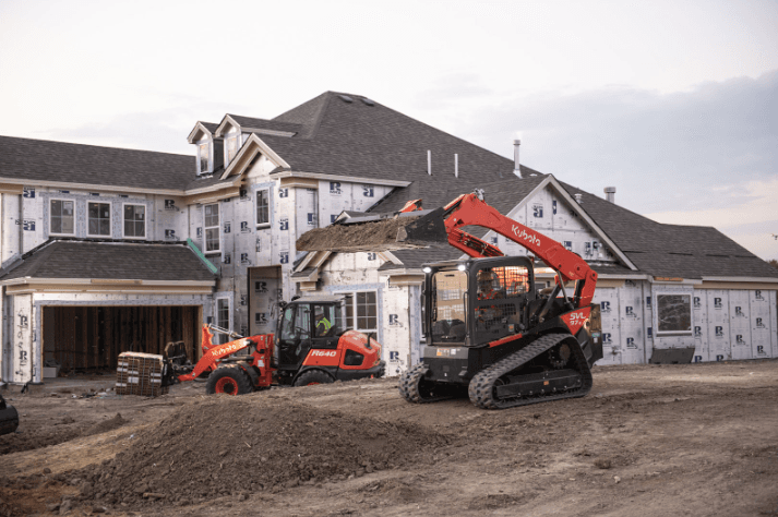 Kubota SVL track loader operating on a residential construction site