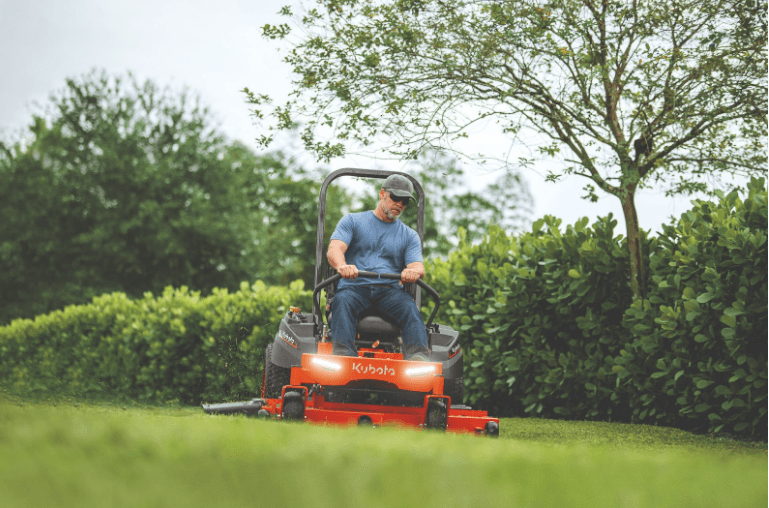 Man operating lawn with a Kubota zero turn mower