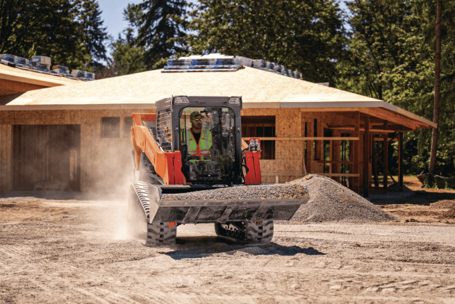 A Kubota Track Loader riding through a construction site